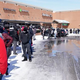 line outside of grocery store after storm
